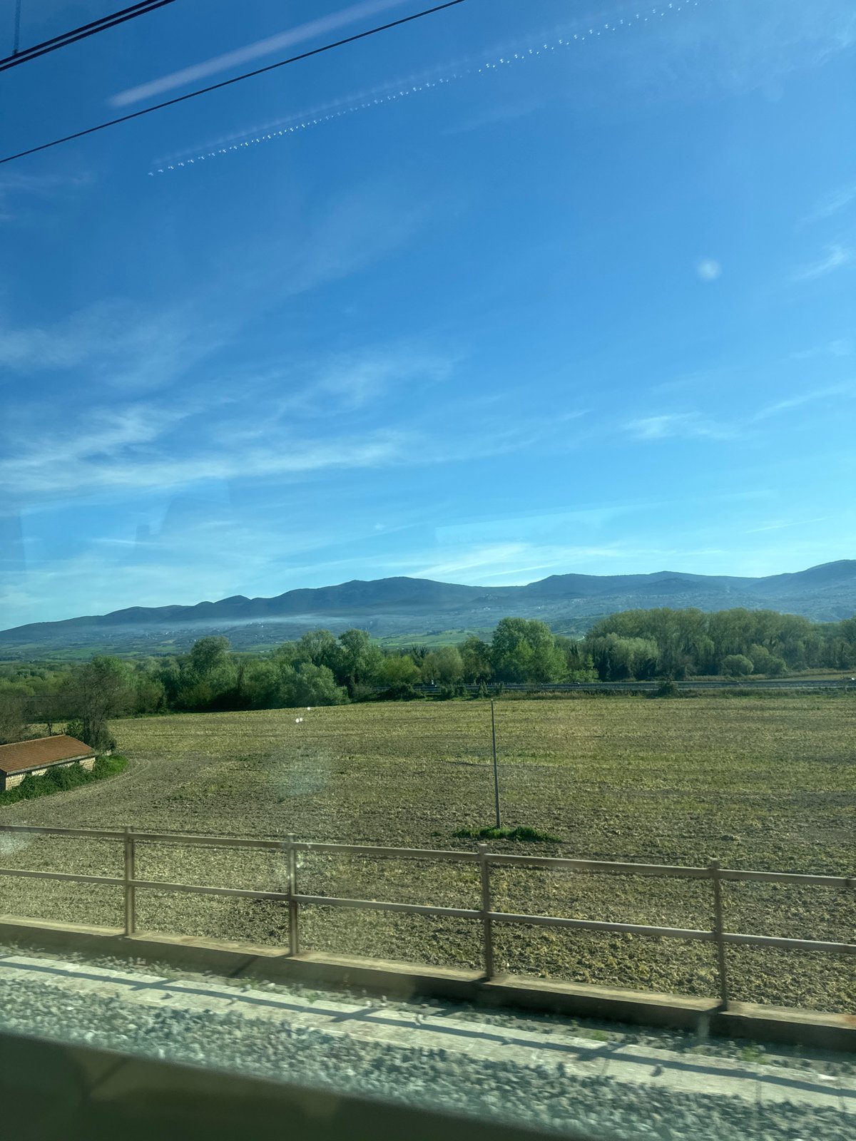Train passenger captures morning sky view in Alviano Scalo