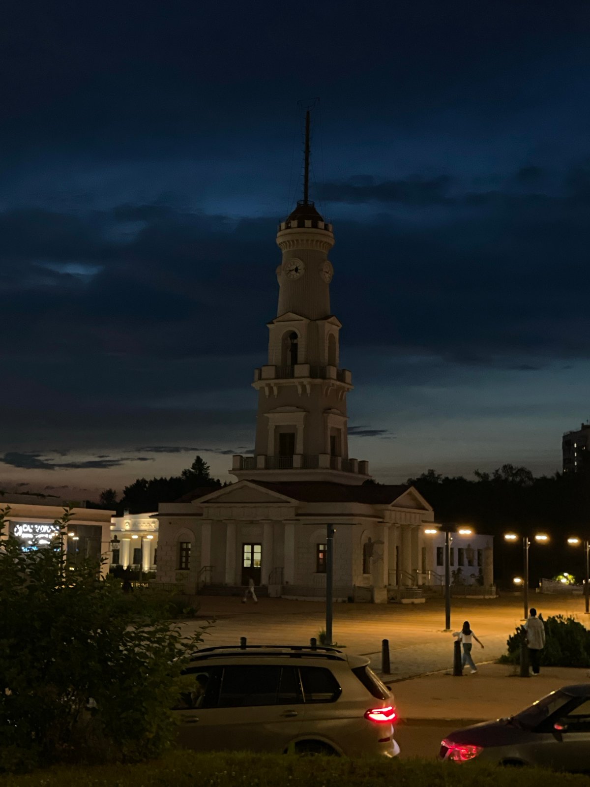Moscow neighborhood park at dusk, sunset colors over playgrounds