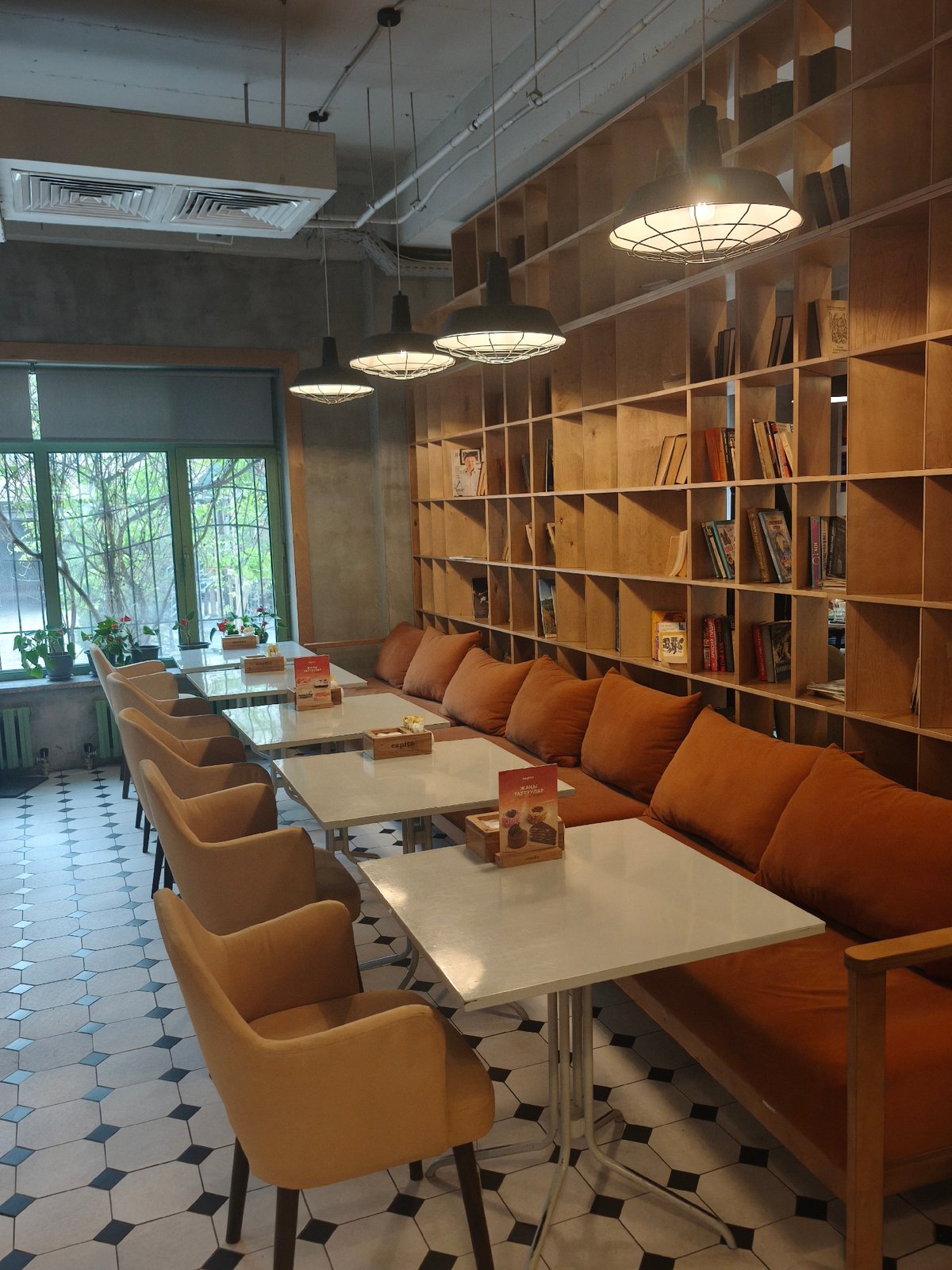 Cafe interior with pastry display captured by witness