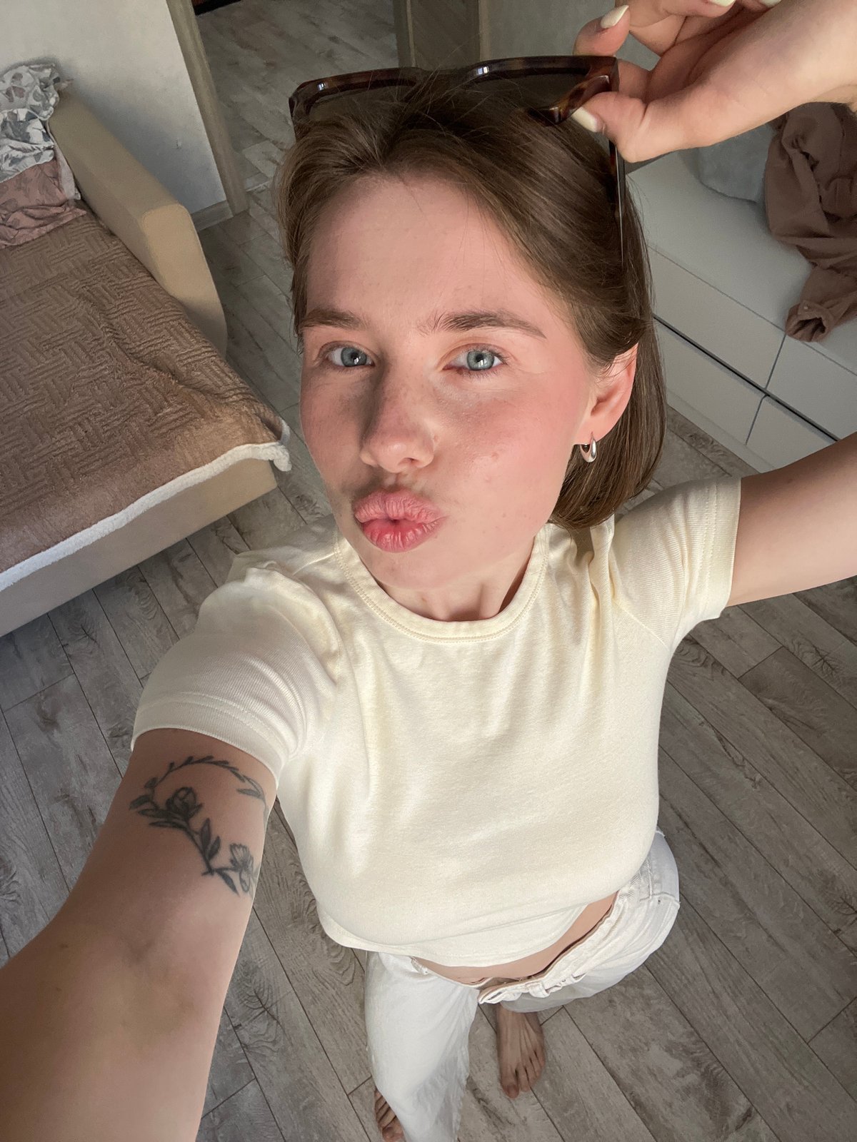 Woman takes selfies indoors in Chaikovsky, Russia early morning