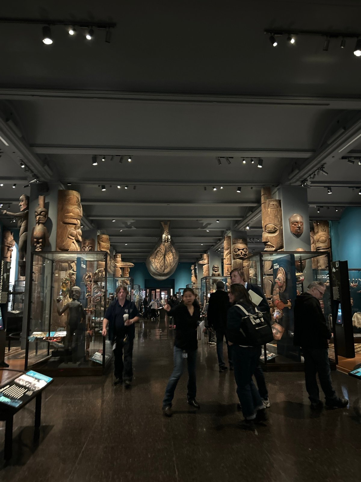 Museum visitors view indigenous totem pole exhibit in NYC