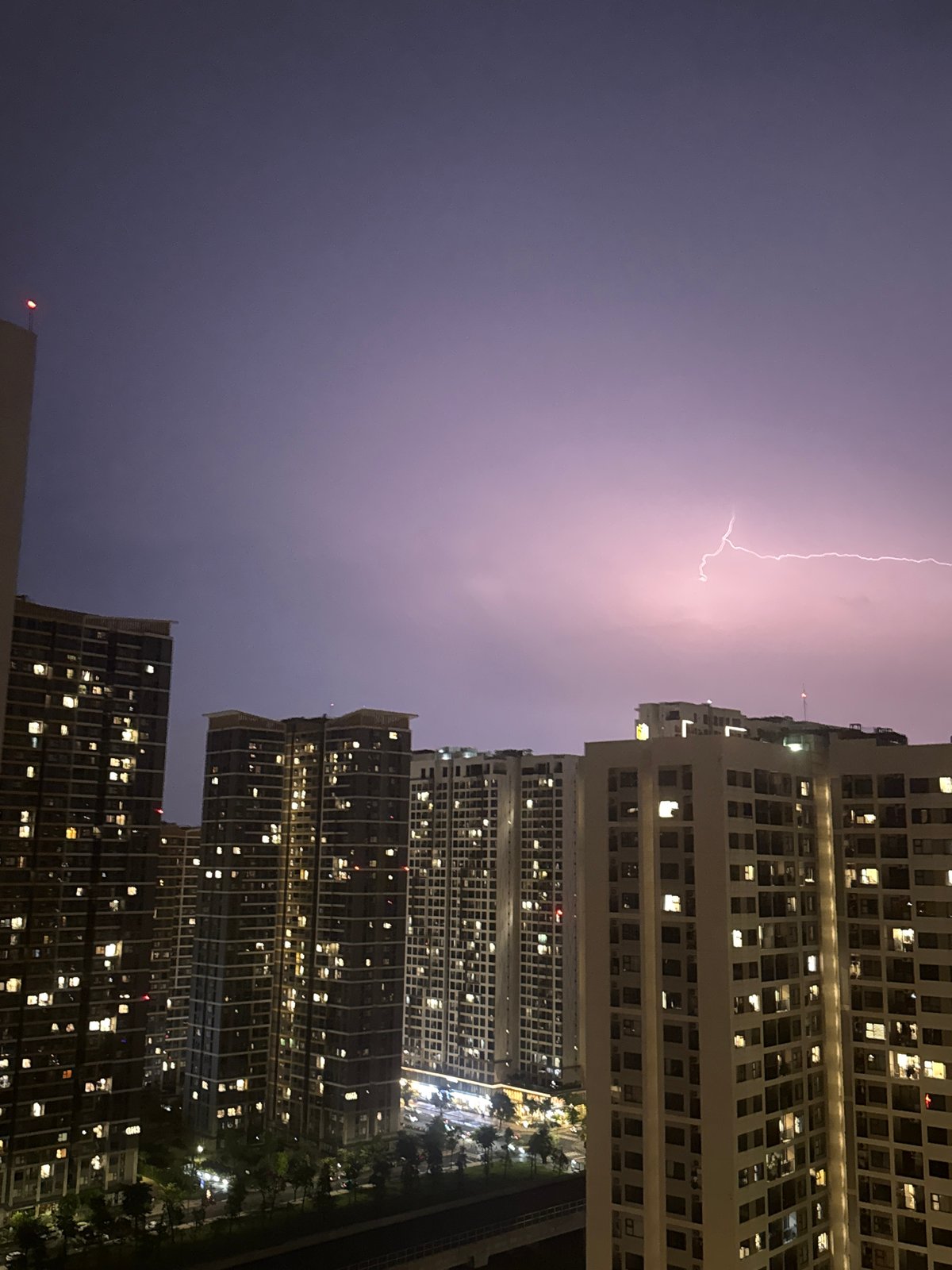 Nighttime apartment buildings illuminated in Thủ Đức, Vietnam