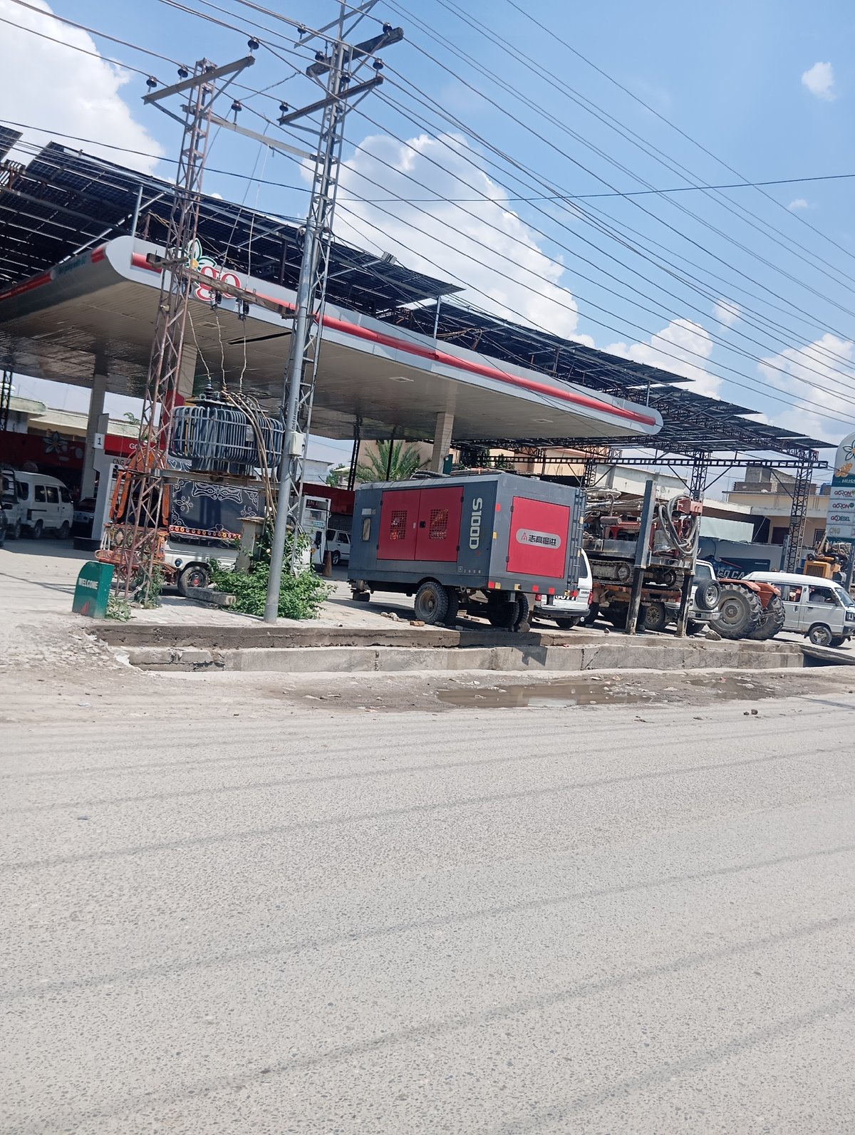 Gas station, fruit stand, and glass building in one morning