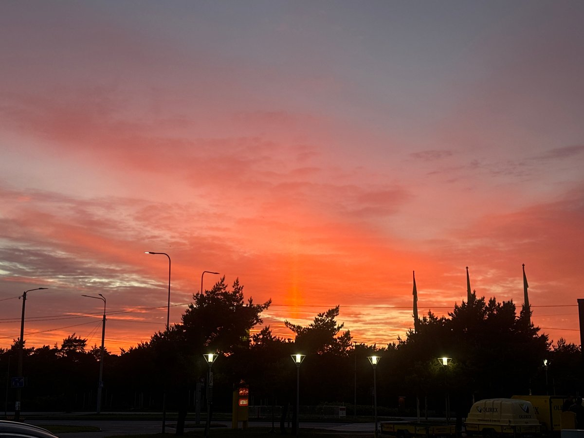 Vibrant sunset illuminates Tallinn skies in dramatic evening display