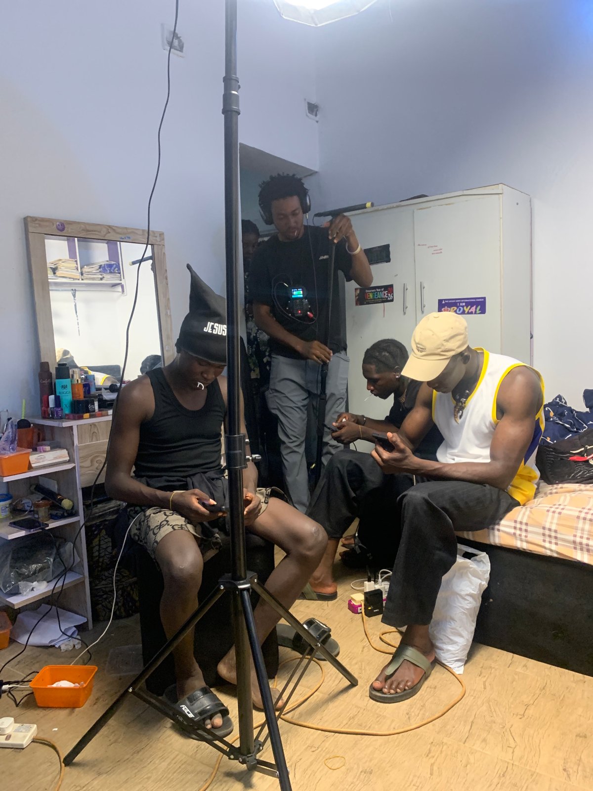 Film crew conducts video shoot in Gwafan, Nigeria room