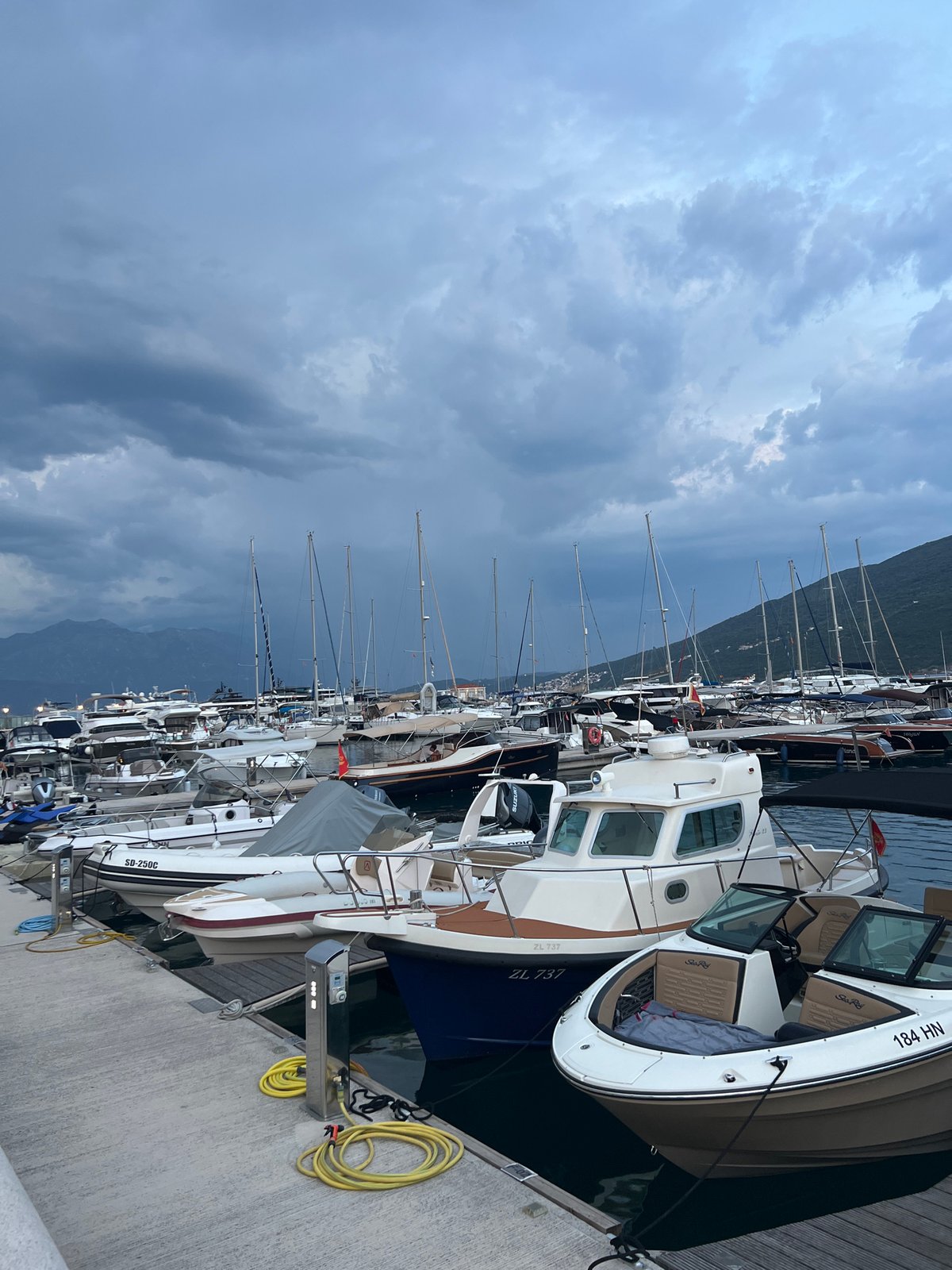 Bay of Kotor waterfront evening: marinas, dining, and live music
