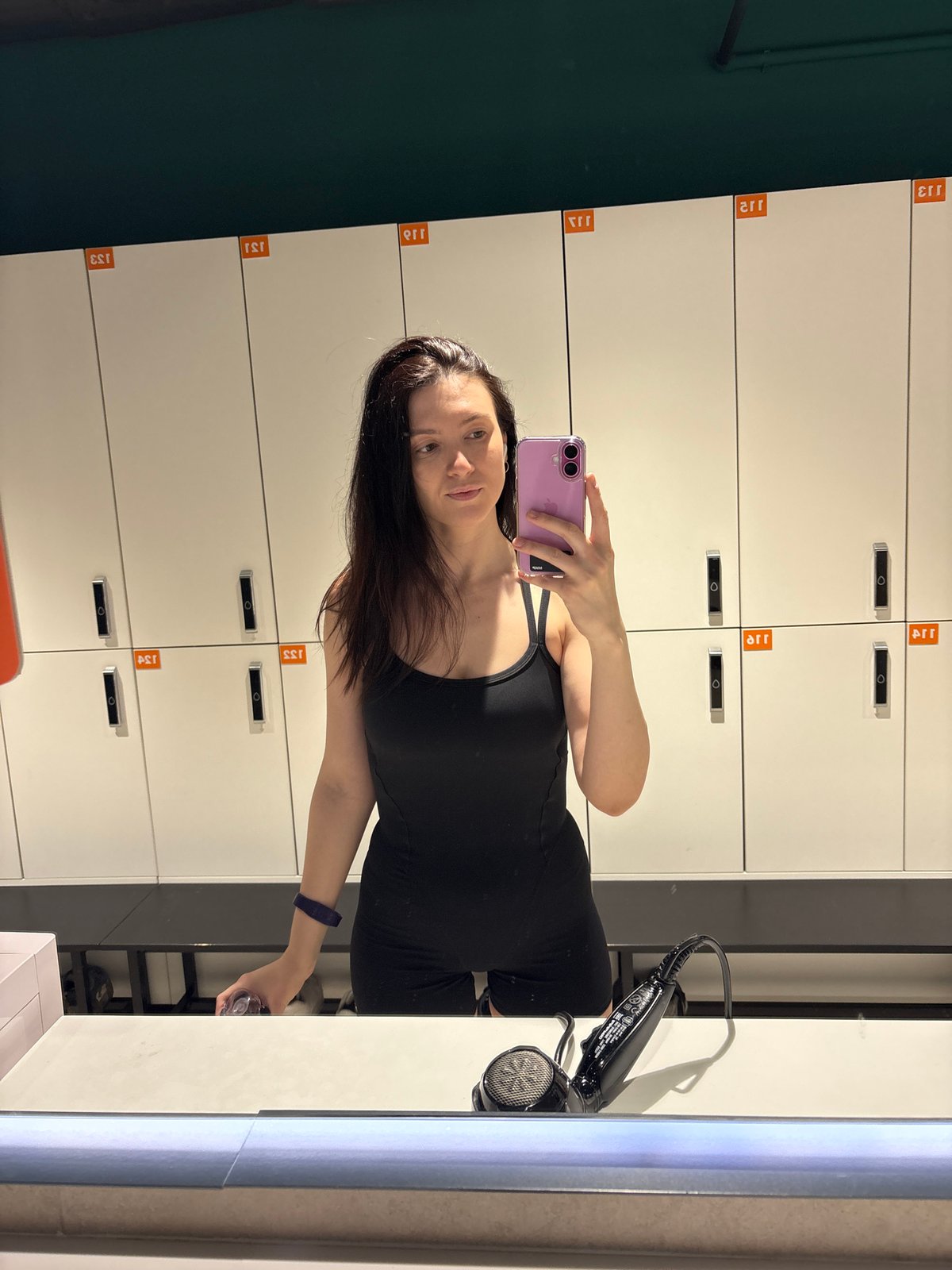 Woman takes selfies in Kazan fitness facility locker room