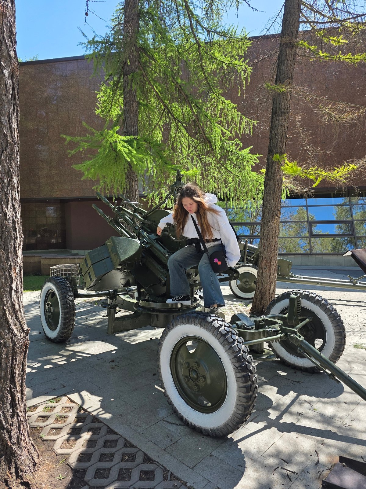 Children play on military memorial artillery in Ufa