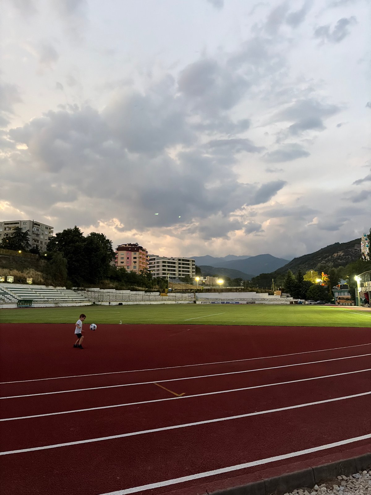 An evening in Sandanski: lakeside lights, tourist train, and park life