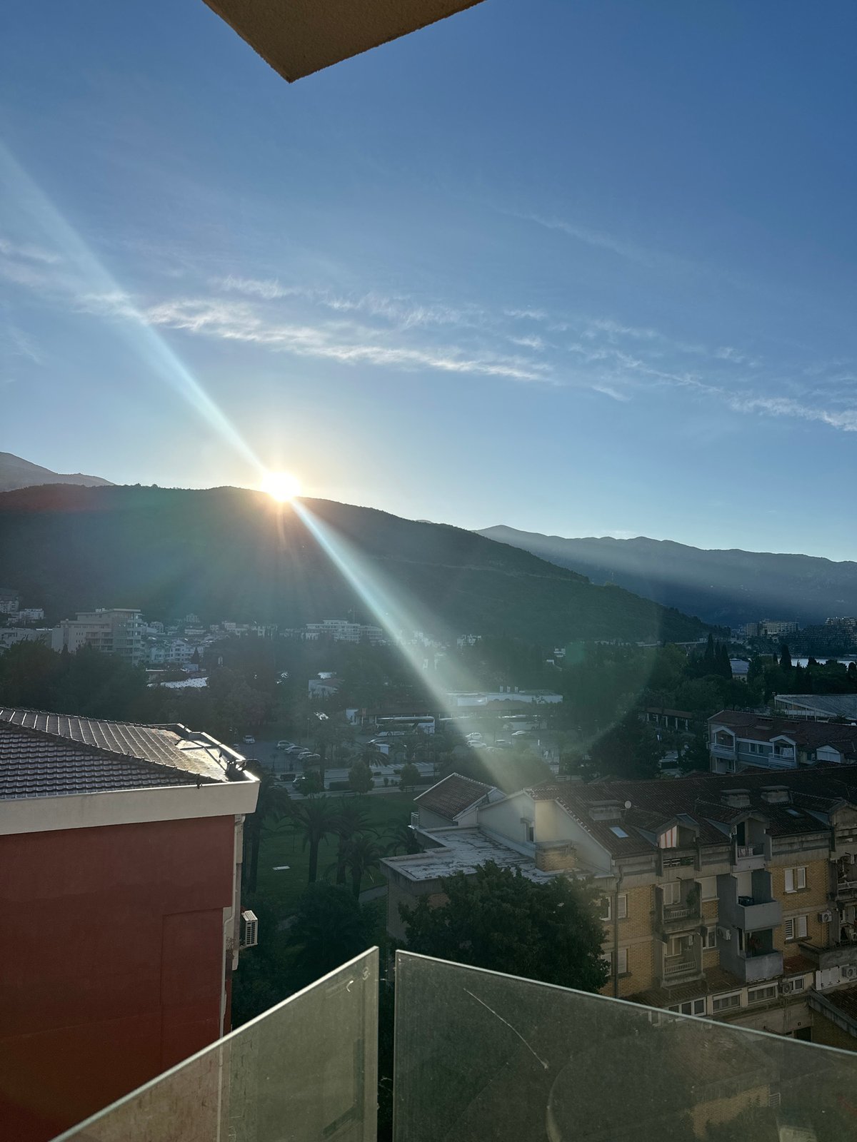 Morning coffee ritual captured in sunny Budva accommodation
