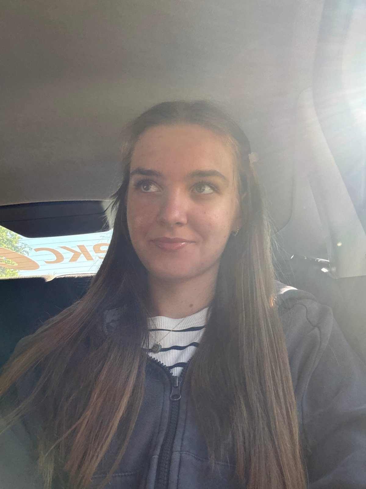 Woman takes selfie in car during early morning in Perm