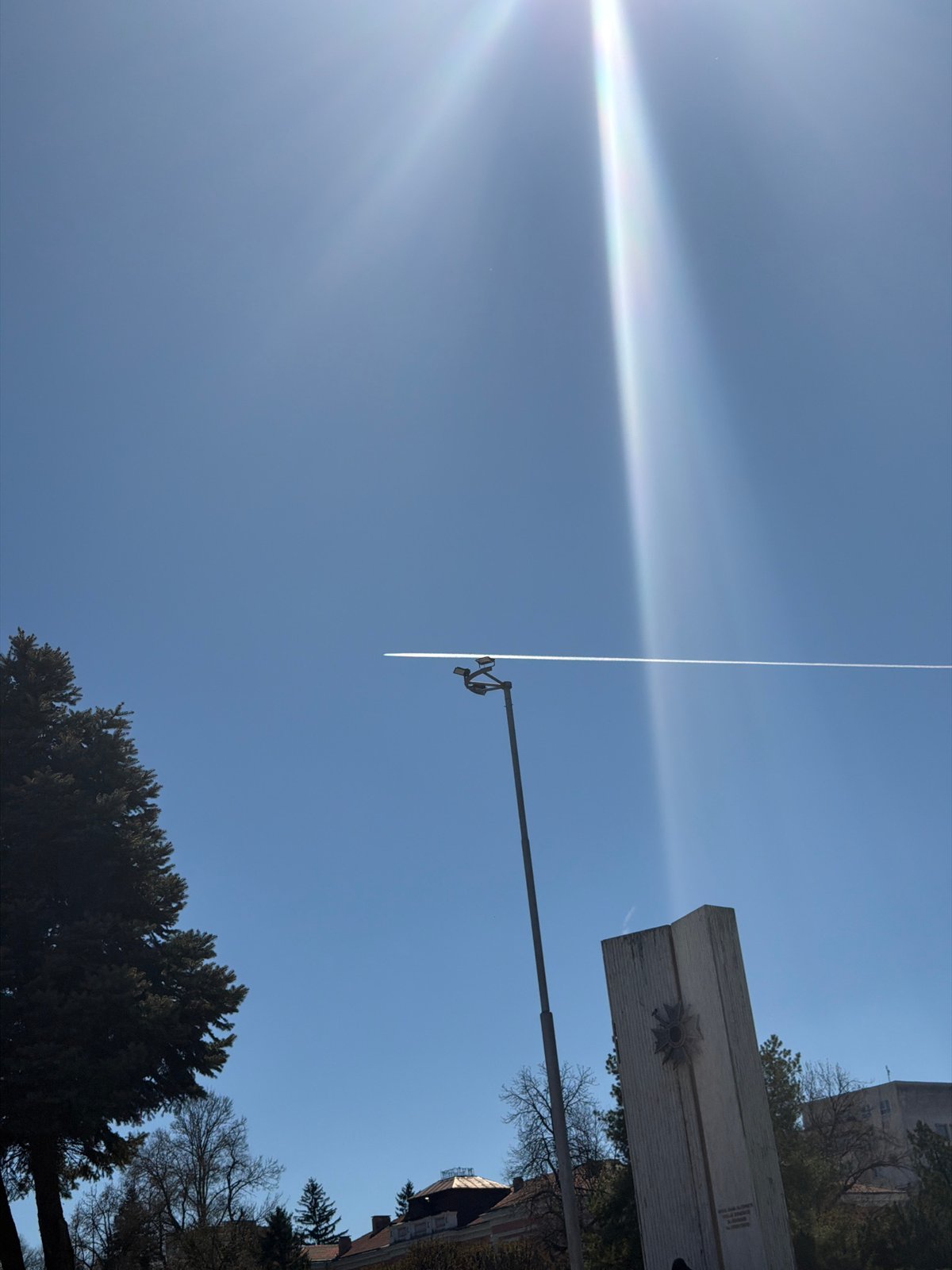 Woman takes selfie on sunny street in Pleven, Bulgaria