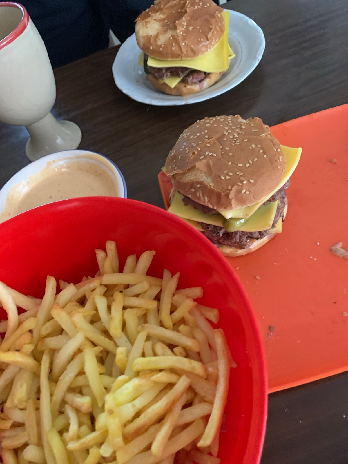 Casual meal with burgers, fries documented in Belgrade suburb