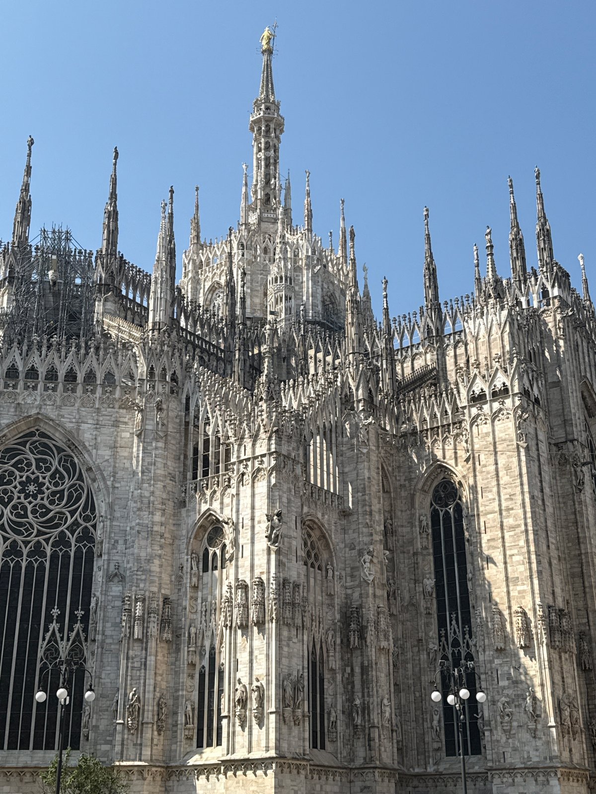 Milan Cathedral's Gothic architecture photographed under clear skies