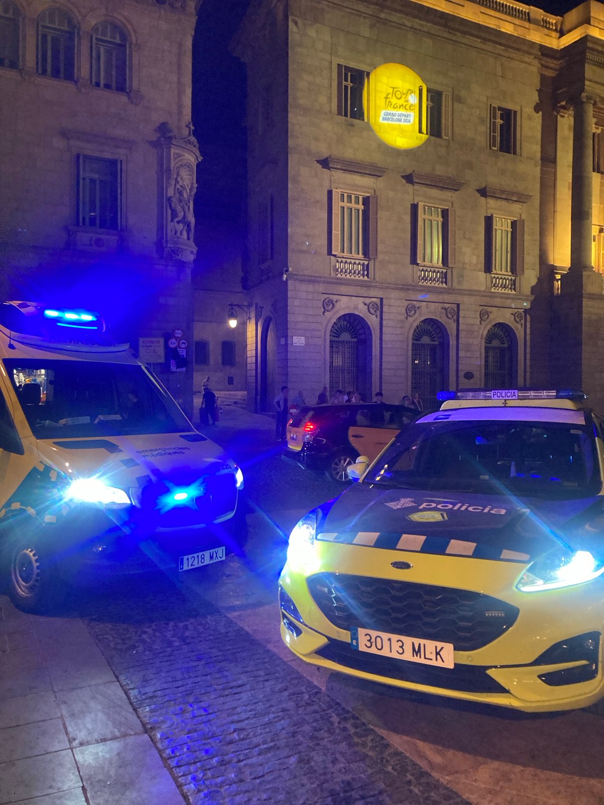 Barcelona's Gothic Quarter at night, Tour de France branding and street scenes