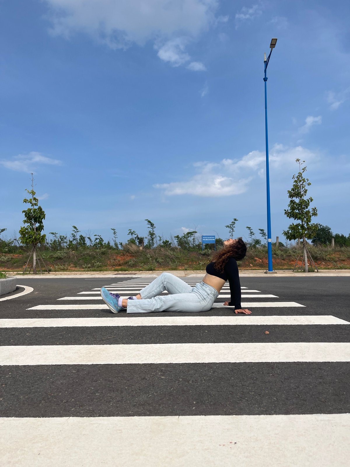 Posing on a pedestrian crossing in Mui Ne, Vietnam