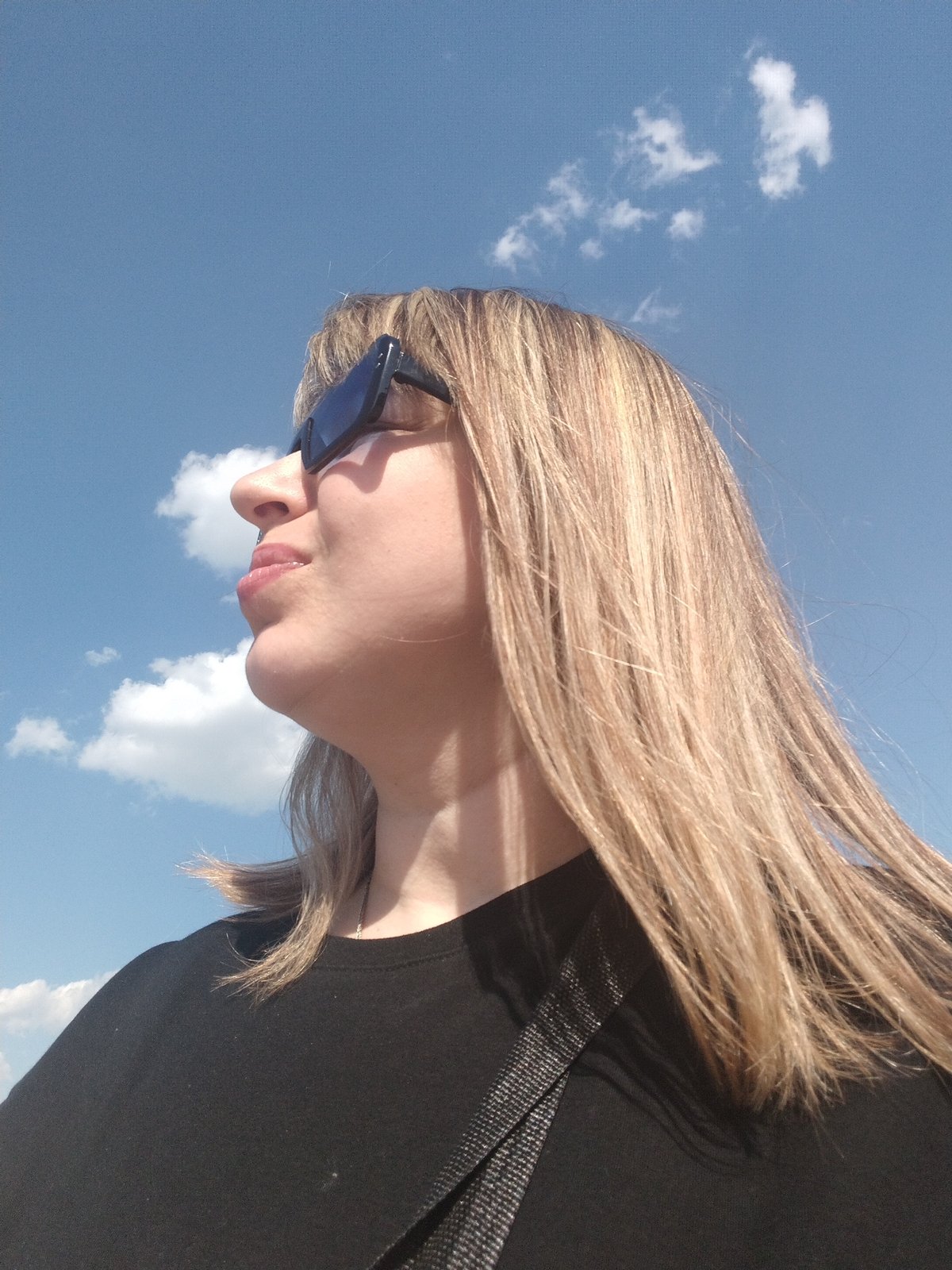 Woman documents selfie session across Yaroslavl outdoor locations