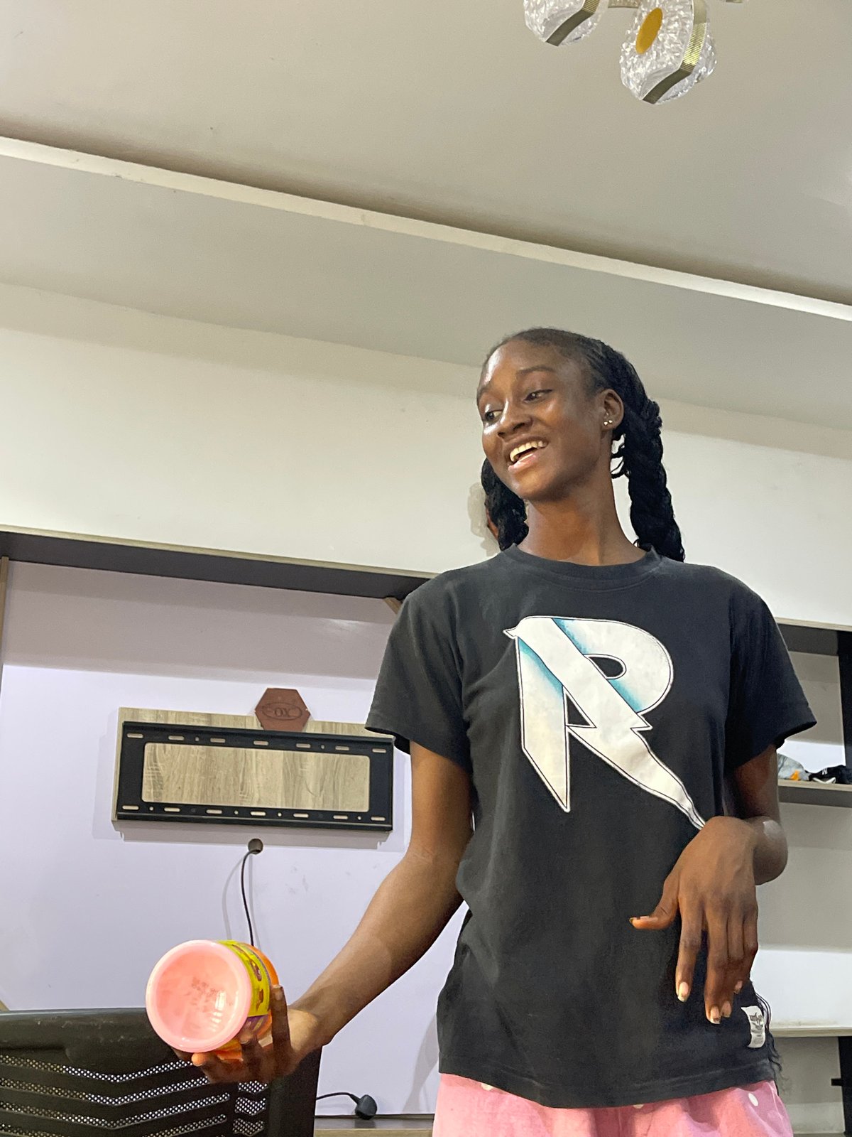 Hair braiding session in progress at an Abuja home