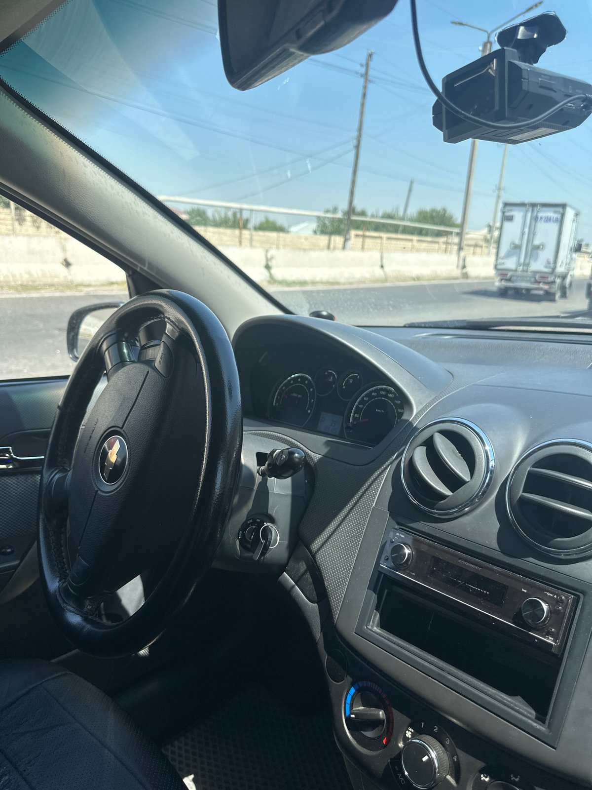 Cruising Tashkent streets in a Chevrolet on a sunny morning