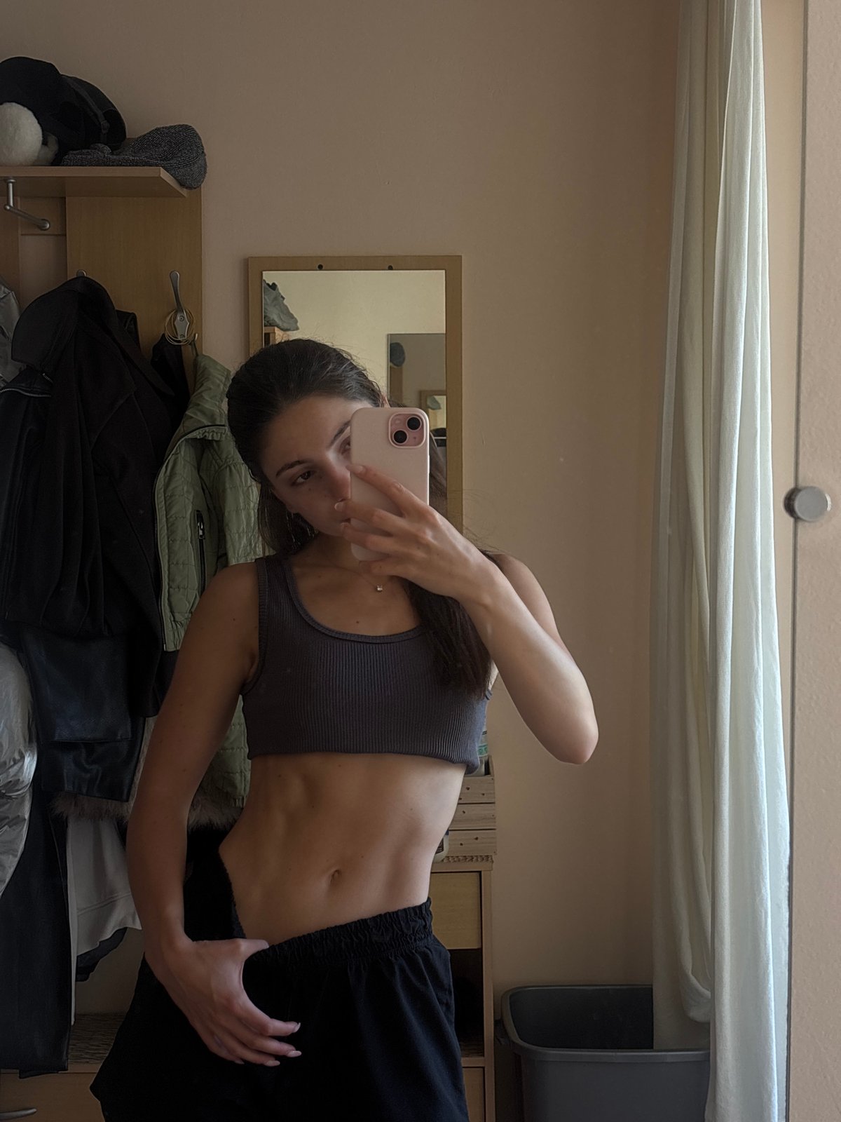Mirror selfie series in a Varna bedroom, athletic wear throughout