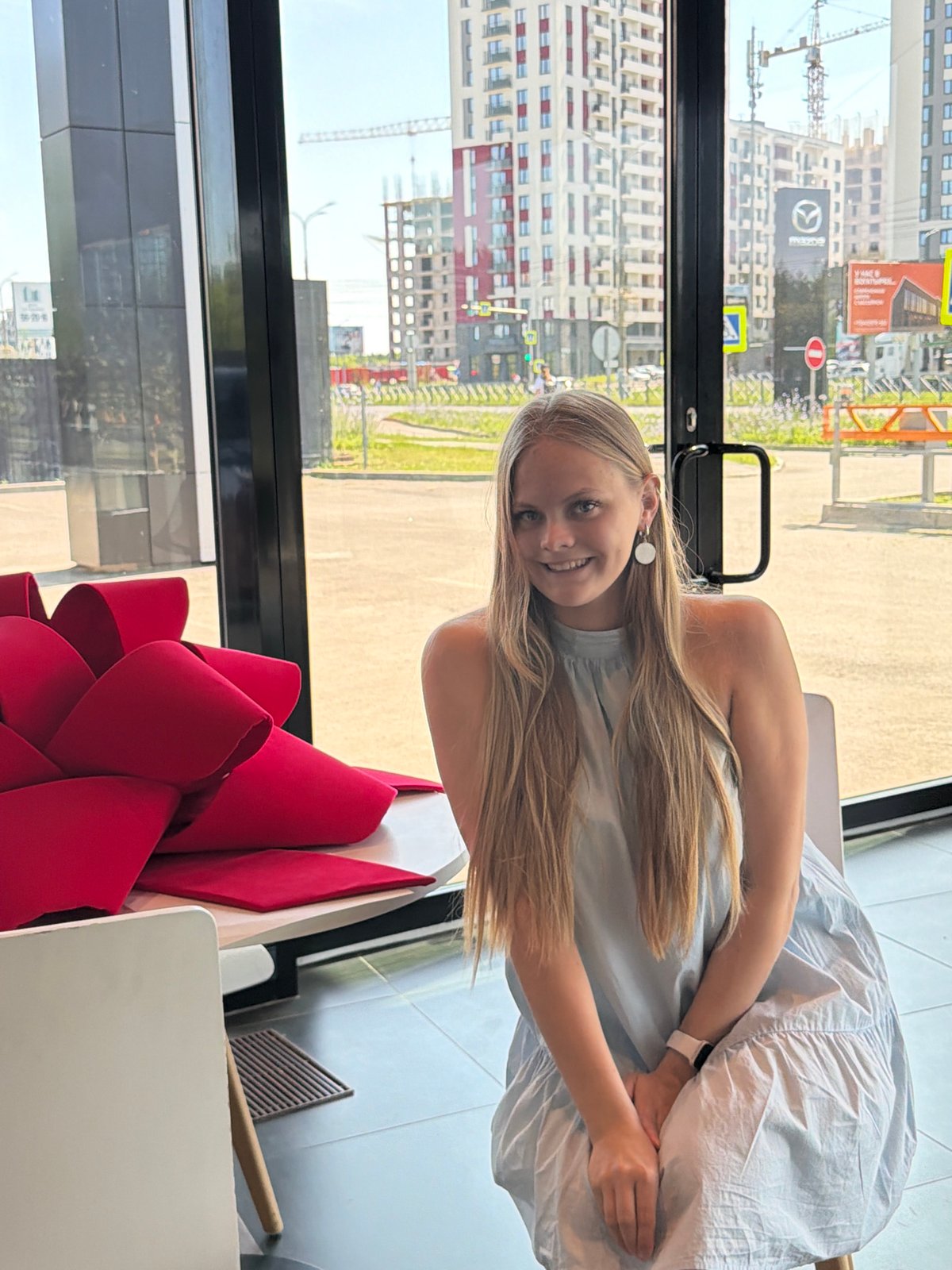 Inside a bright Izhevsk showroom with a striking red bow