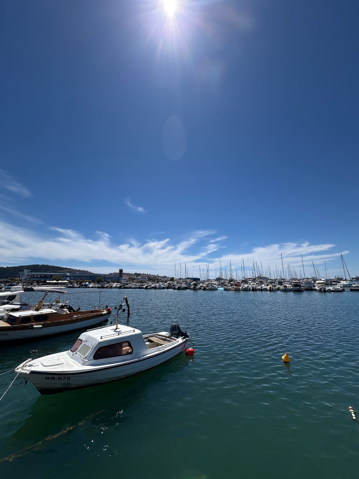 Sunny waterfront walk through Bar, Montenegro's marina and parks