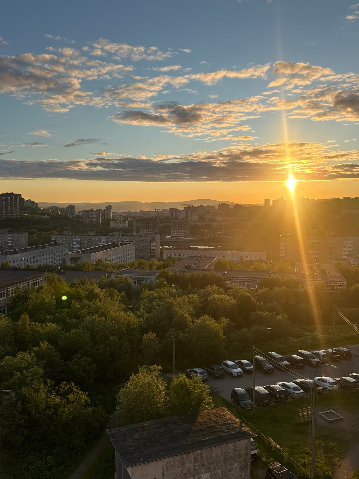 Murmansk city skyline bathed in late evening golden light