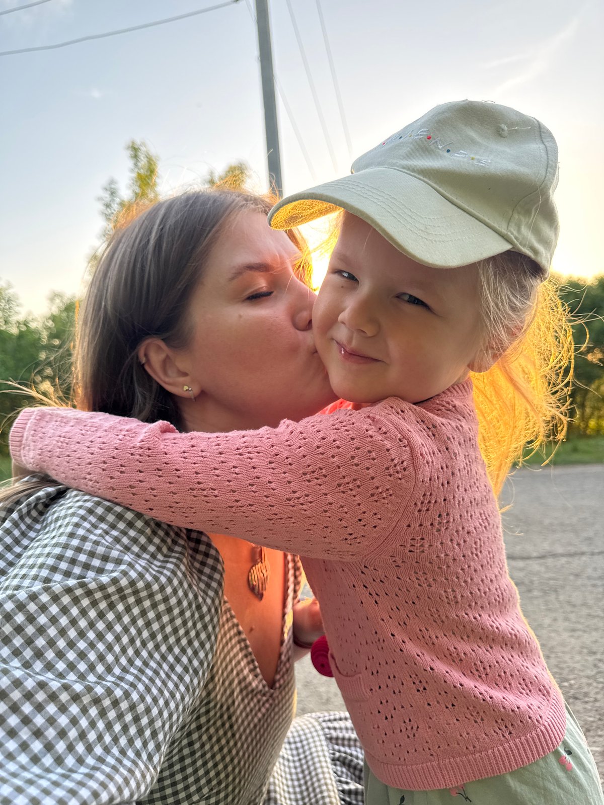 Mother and child enjoy evening moments in Russian town