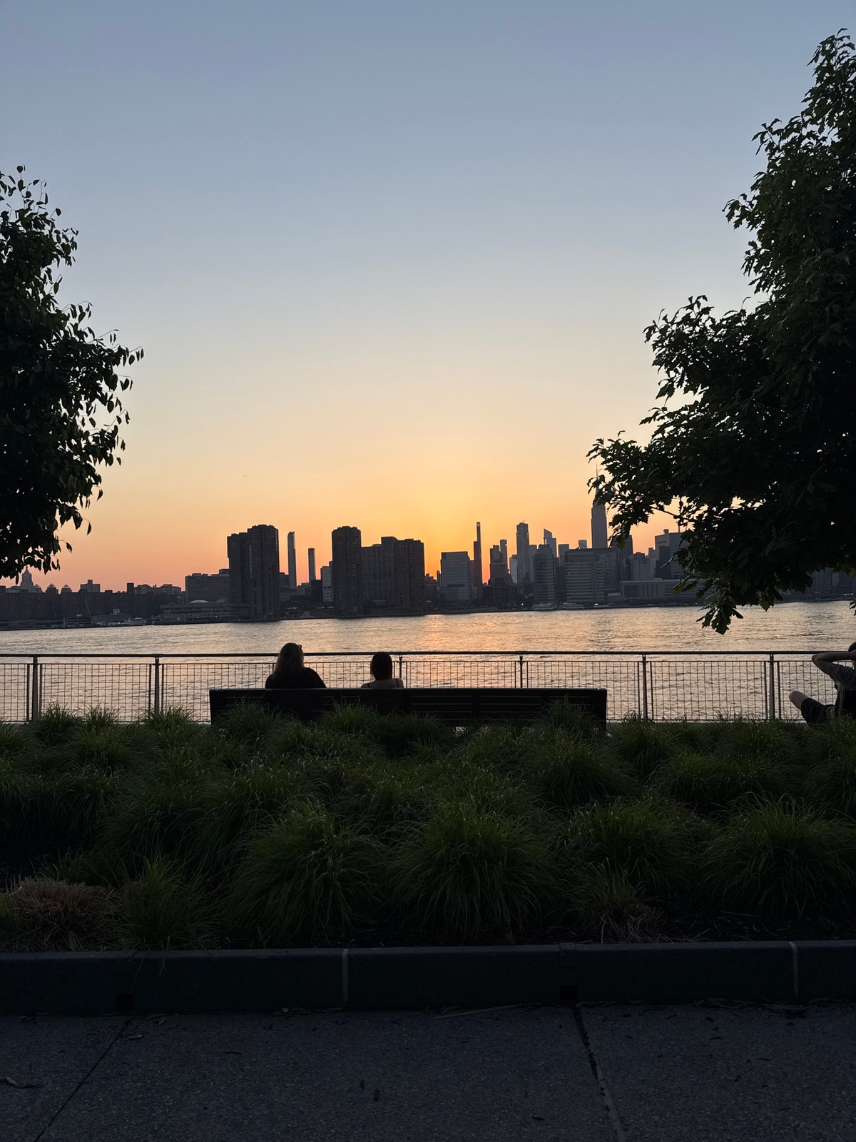 NYC skyline observed at sunset from Manhattan viewpoint