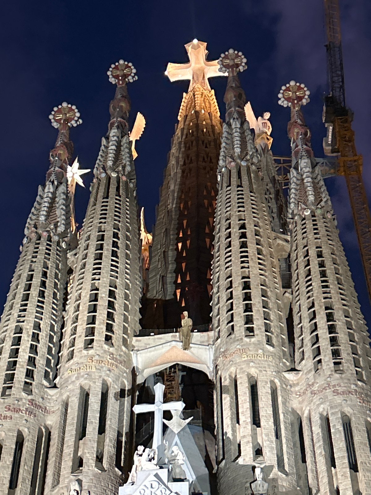 Tourist captures nighttime views of illuminated Sagrada Familia