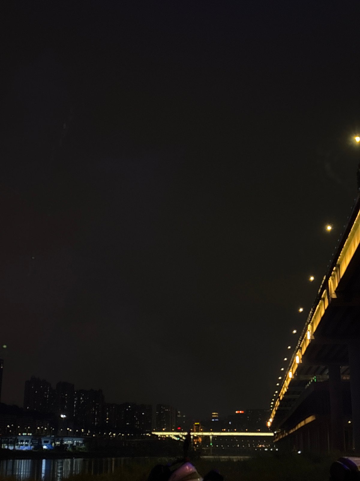 Nighttime riverside scenes documented across Chongqing districts