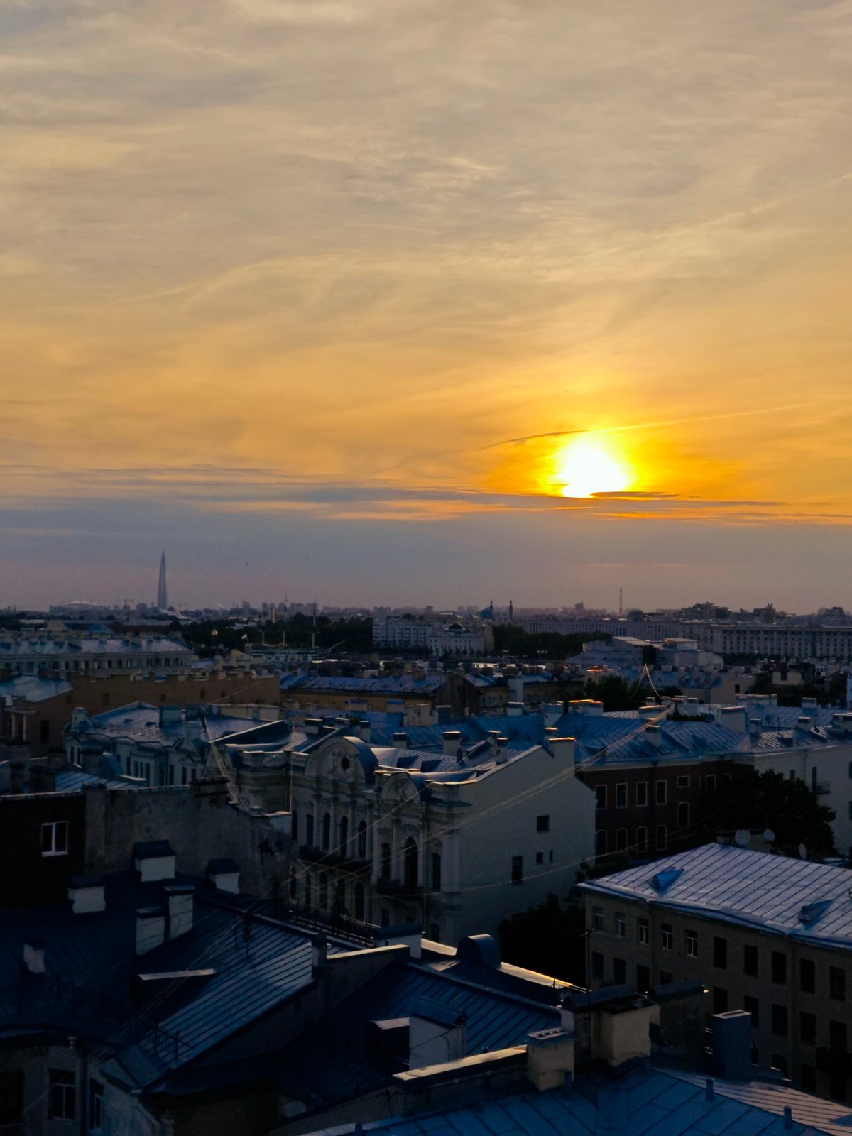 Saint Petersburg residents document sunset evening across city rooftops