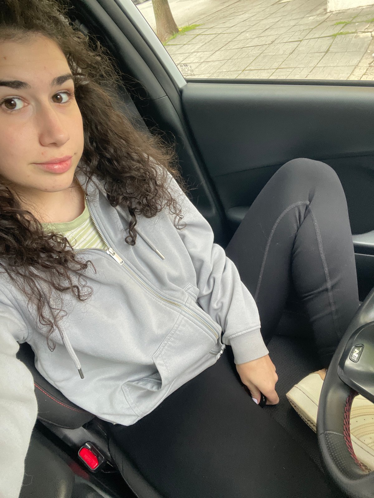 Woman documents casual morning moments in Sofia car and bedroom