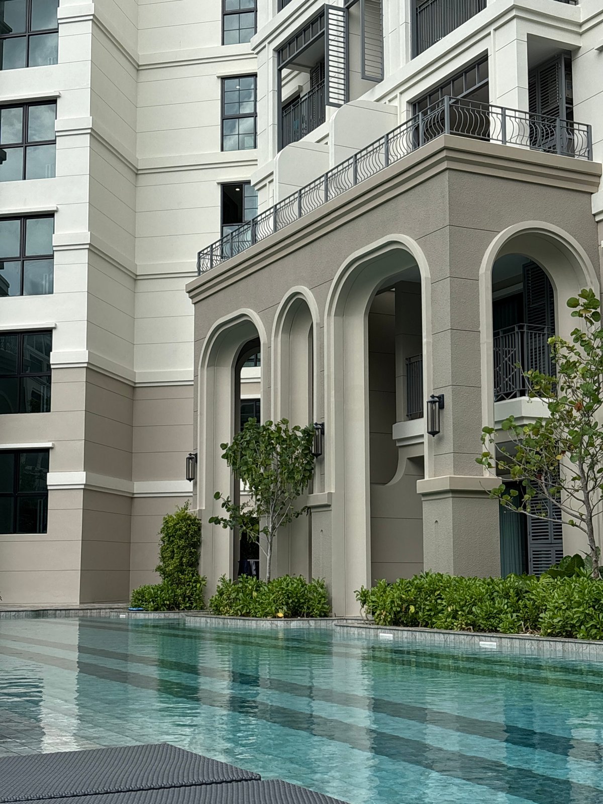 Poolside moments captured at Choeng Thale luxury apartment complex
