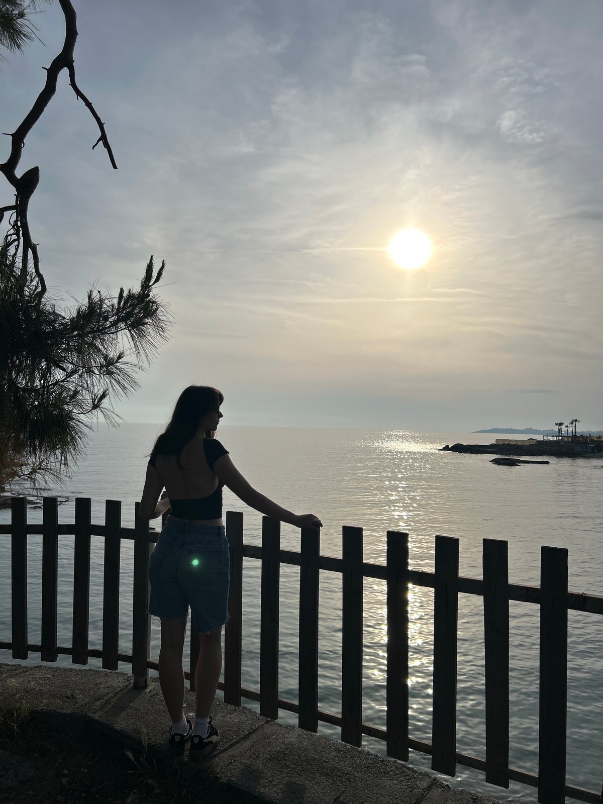 Woman photographs Mediterranean coastline scenes in sunny Alanya