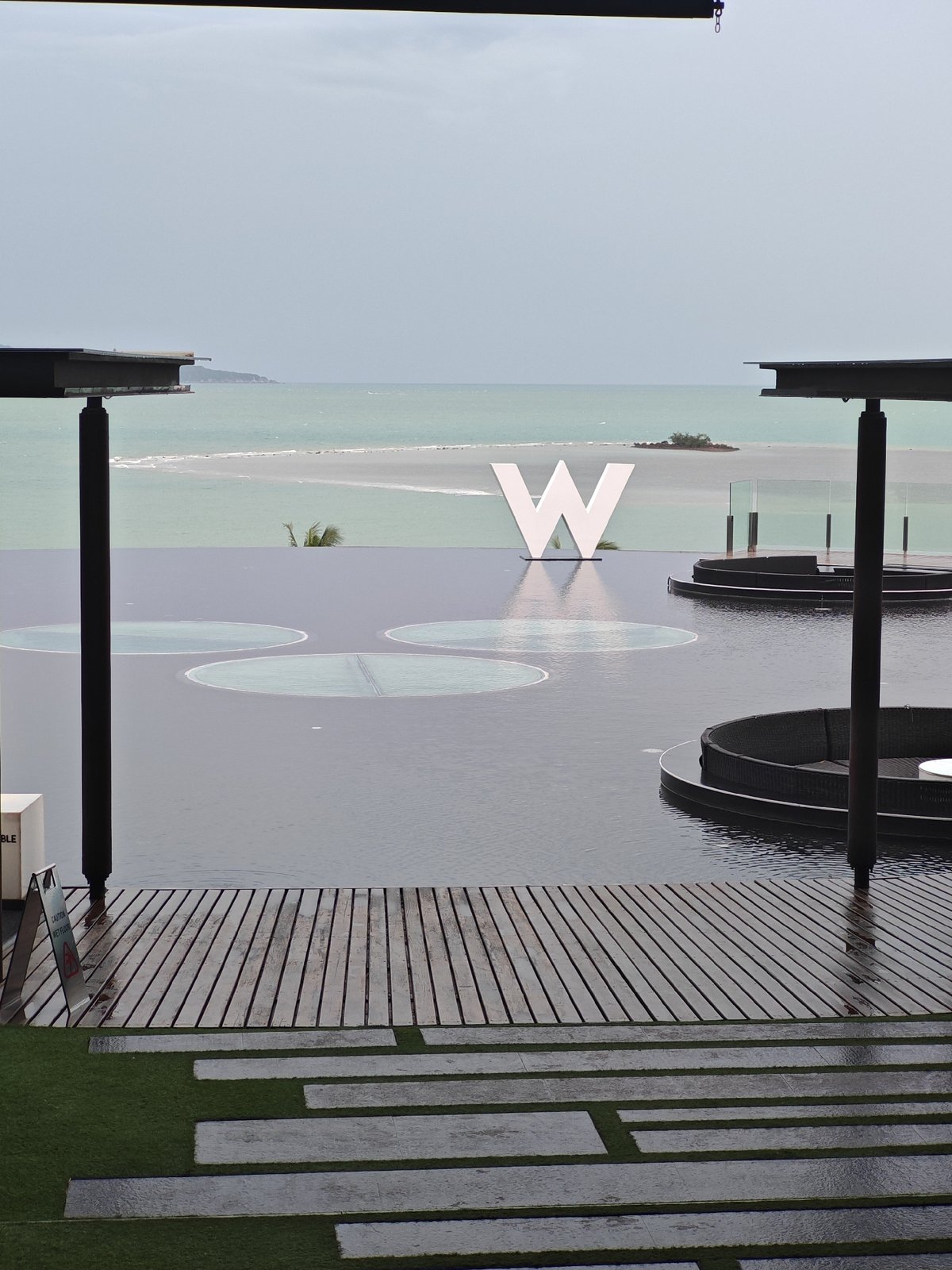 W Koh Samui's infinity pool and ocean-facing sculpture
