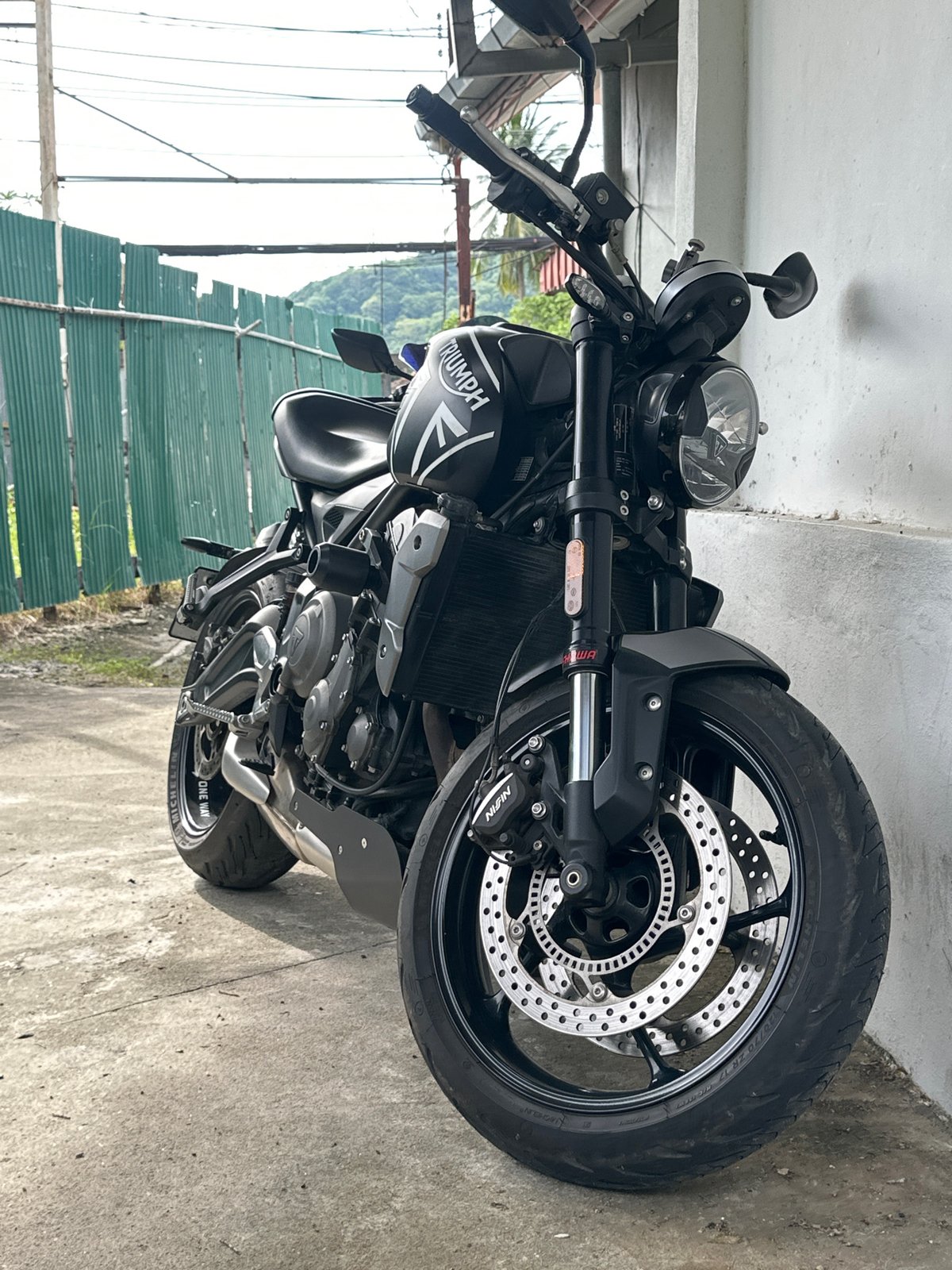 Sport bikes parked up in Karon, with a lizard stealing the show
