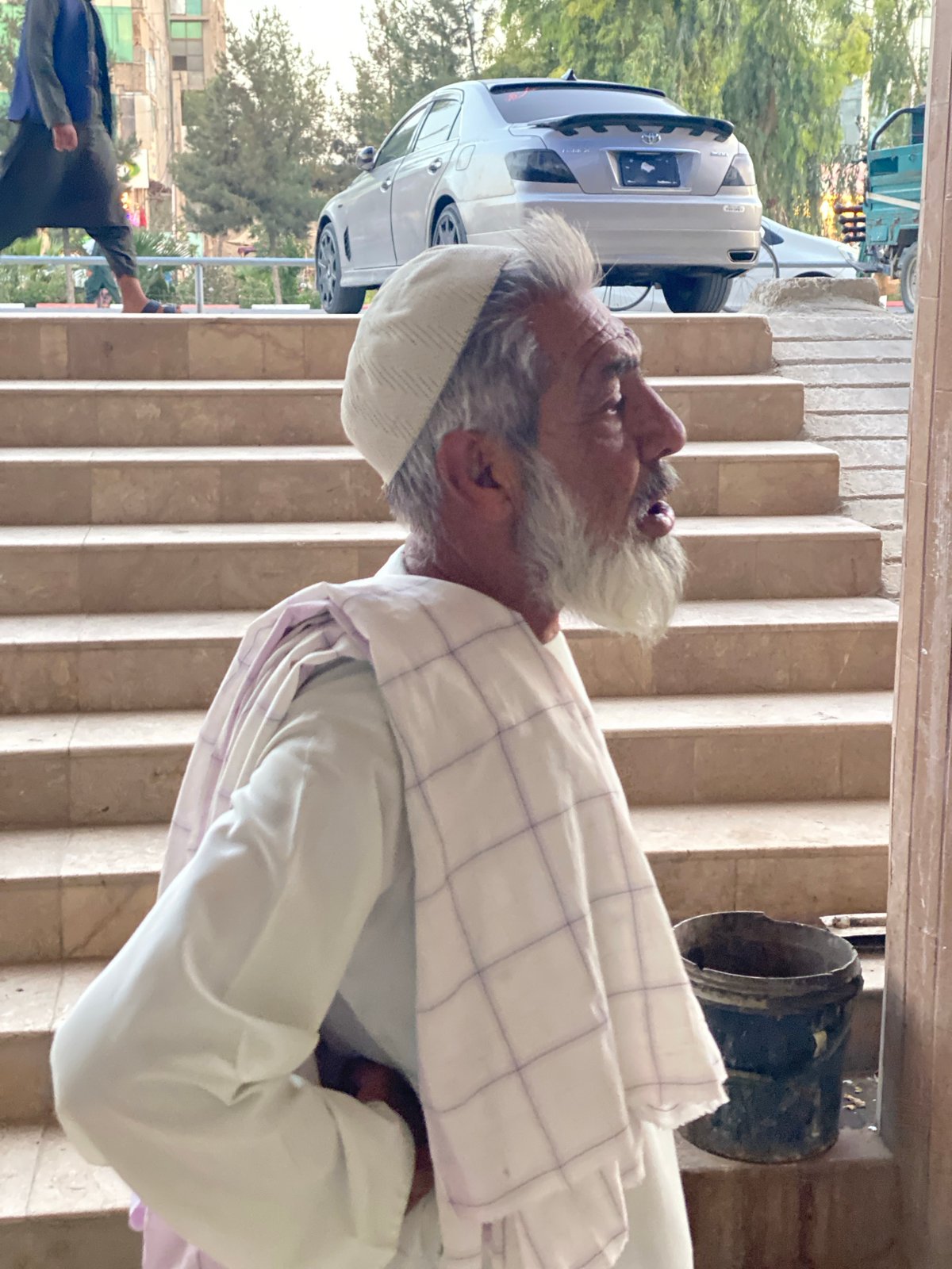 Street-level moments near a stairway in Kandahar