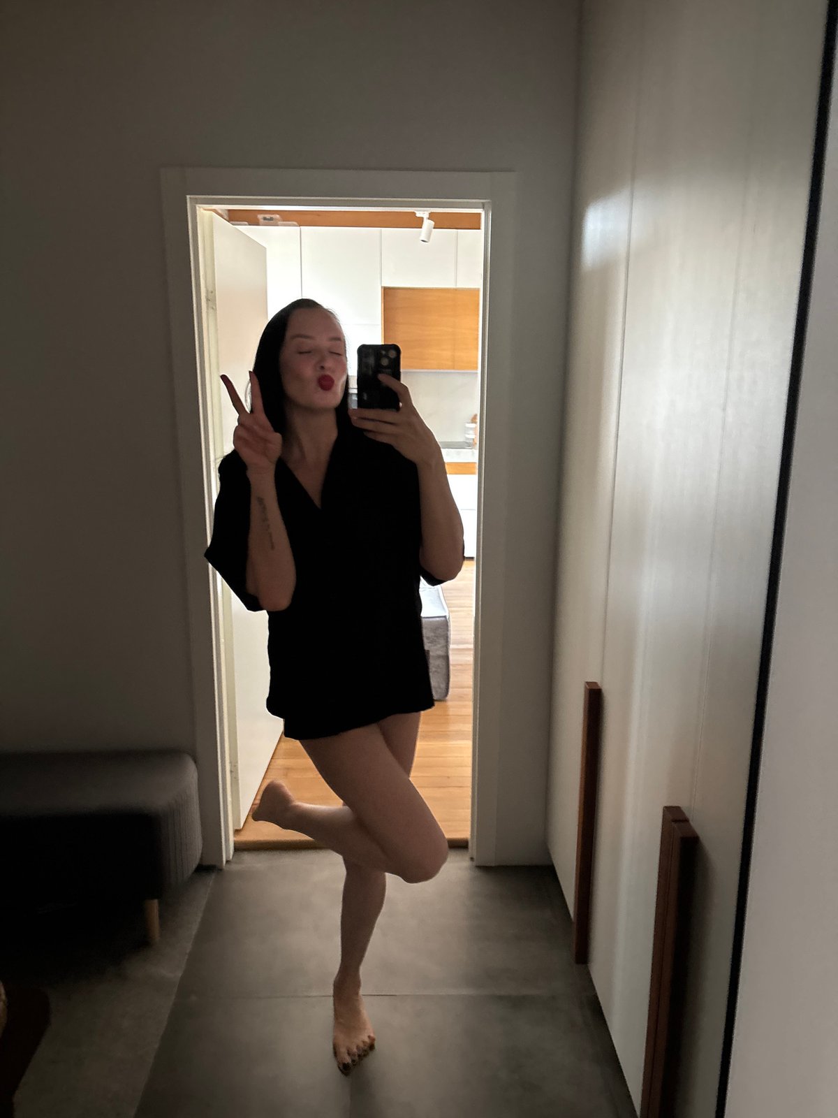 Woman takes playful mirror selfie in Chaikovsky, Russia