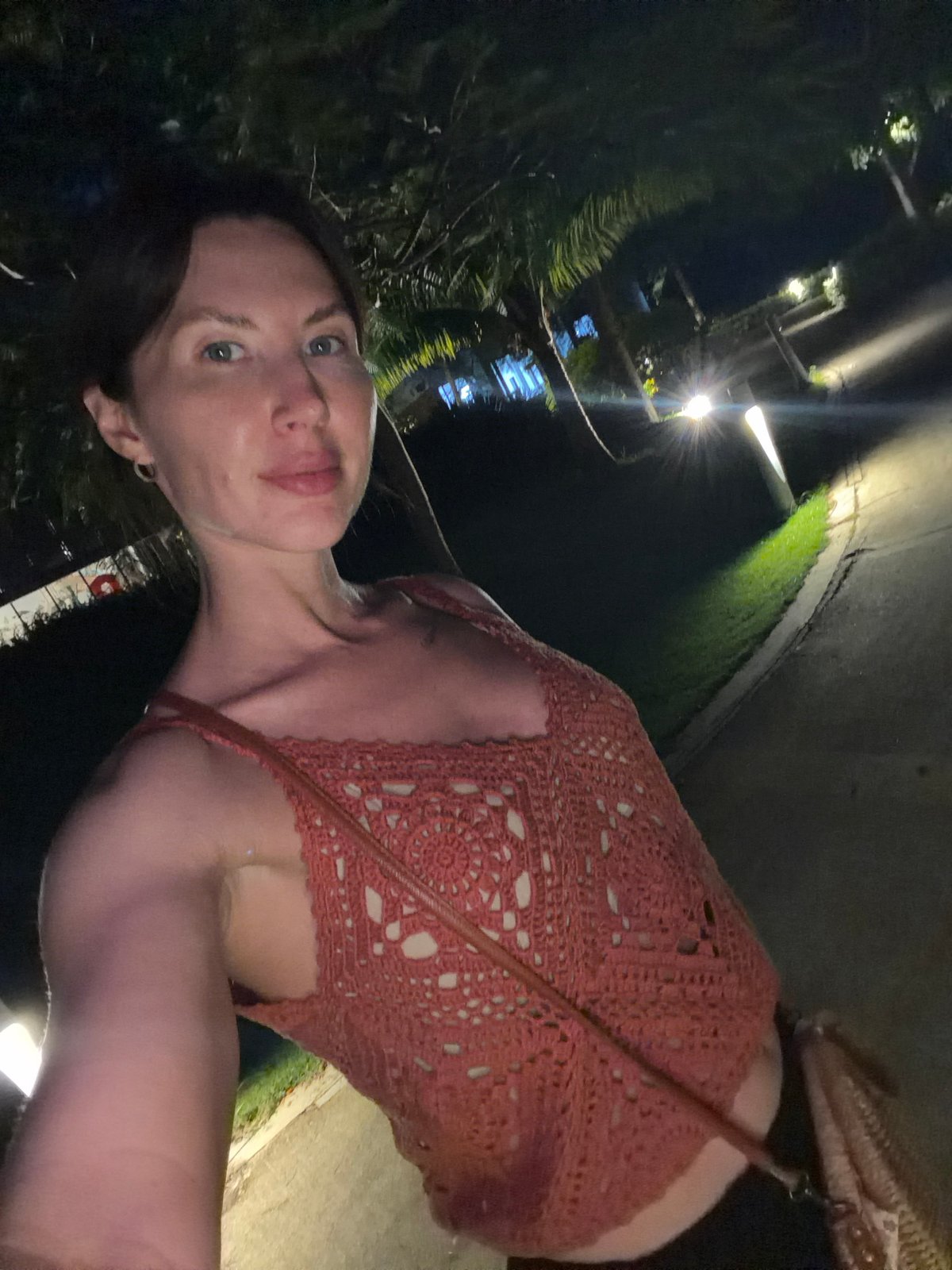 Woman documents tropical resort evening in Vietnam