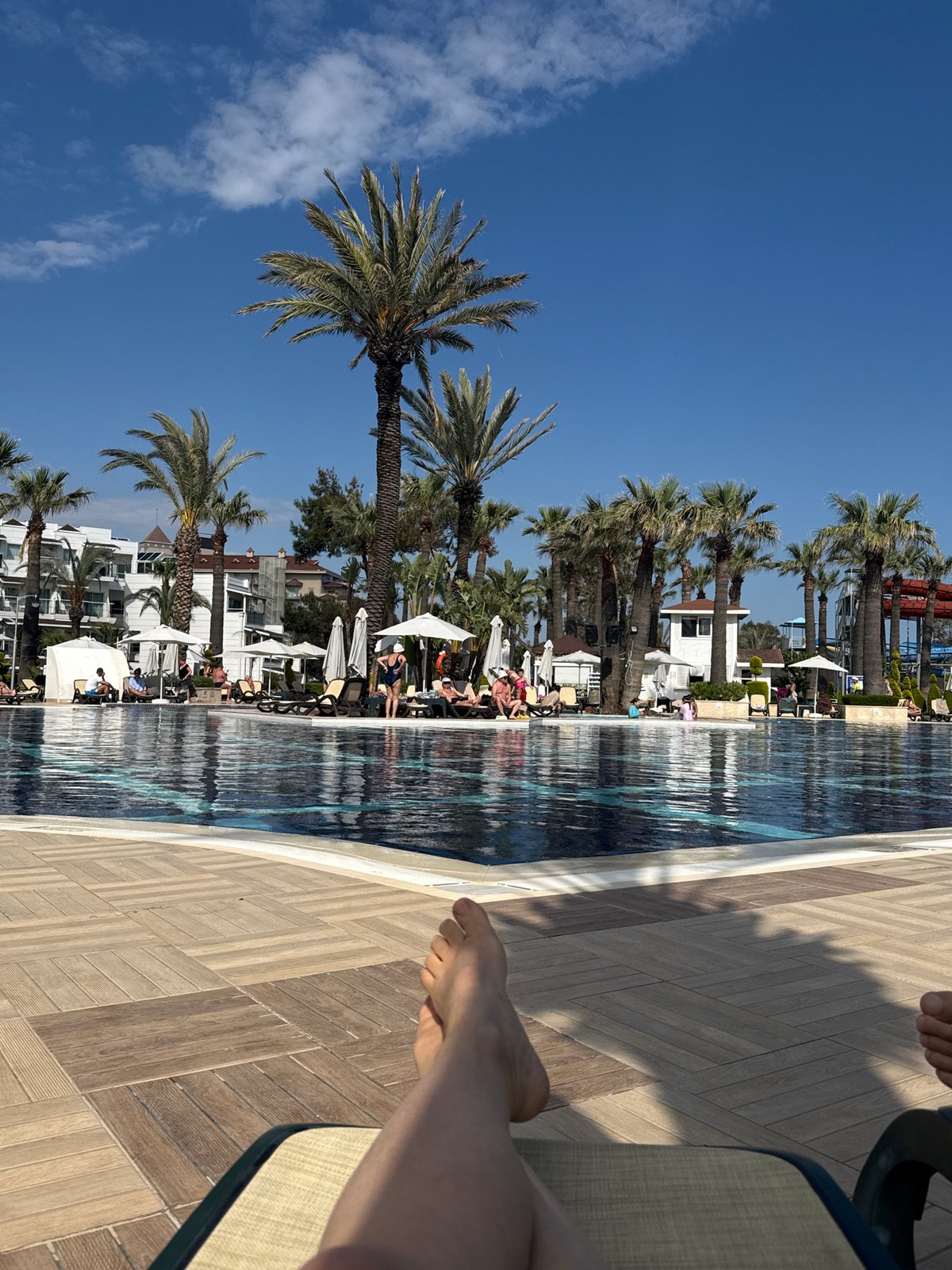 Resort guests enjoy poolside activities in Serik, Turkey
