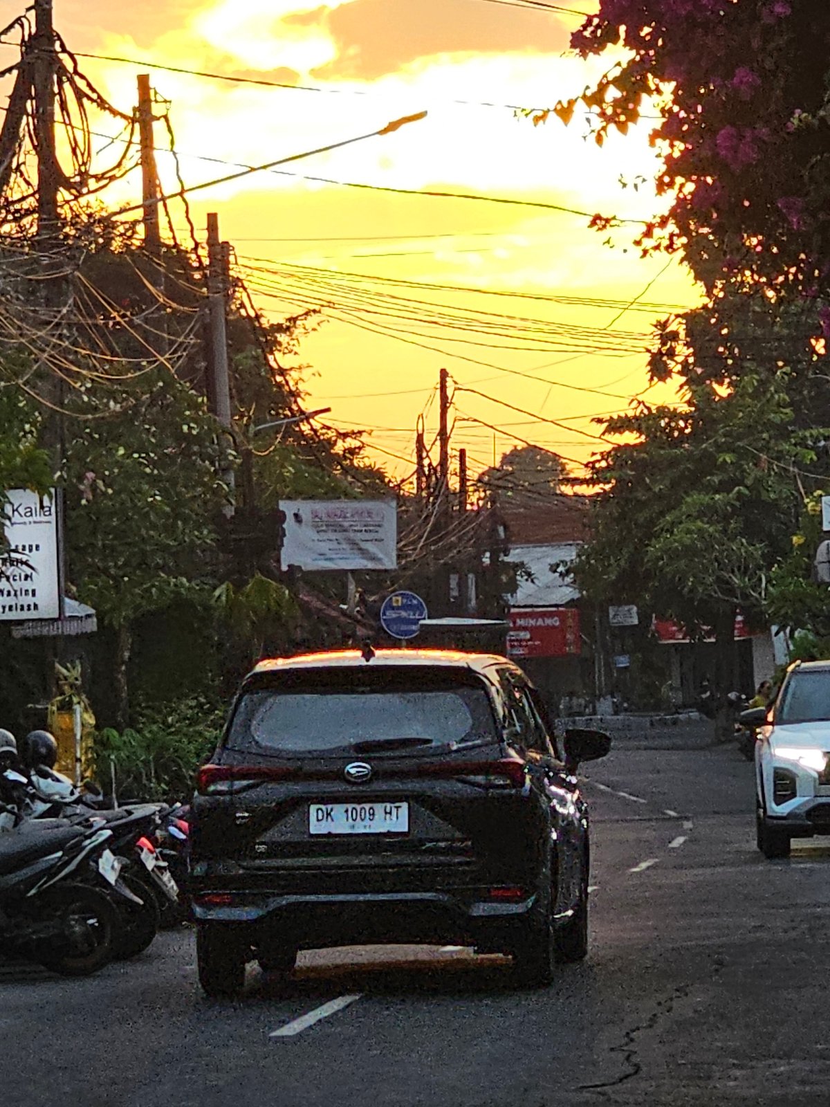 Evening scenes capture daily life across Denpasar during golden hour