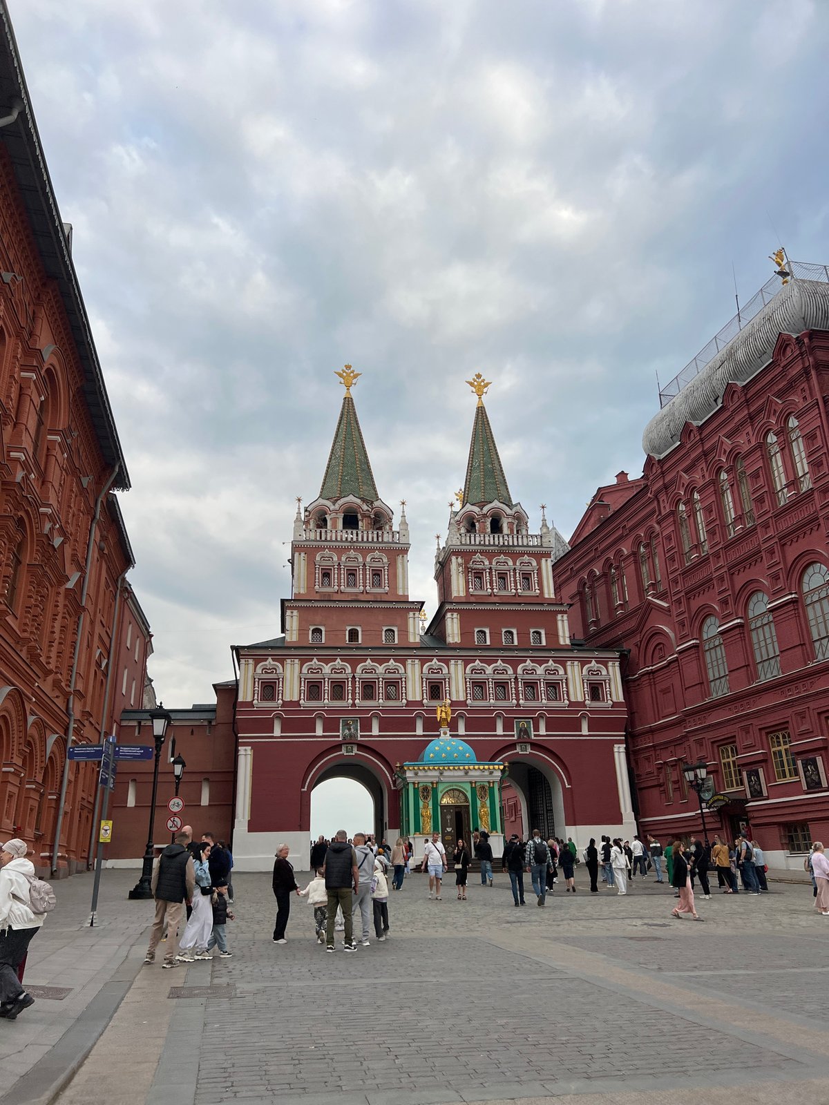 Pedestrians walk near Moscow's Red Square, Kremlin towers