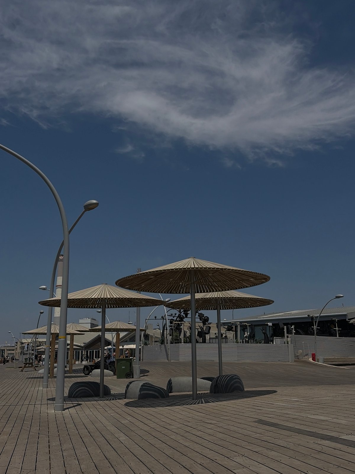 Person documents Tel Aviv waterfront scenes during morning visit
