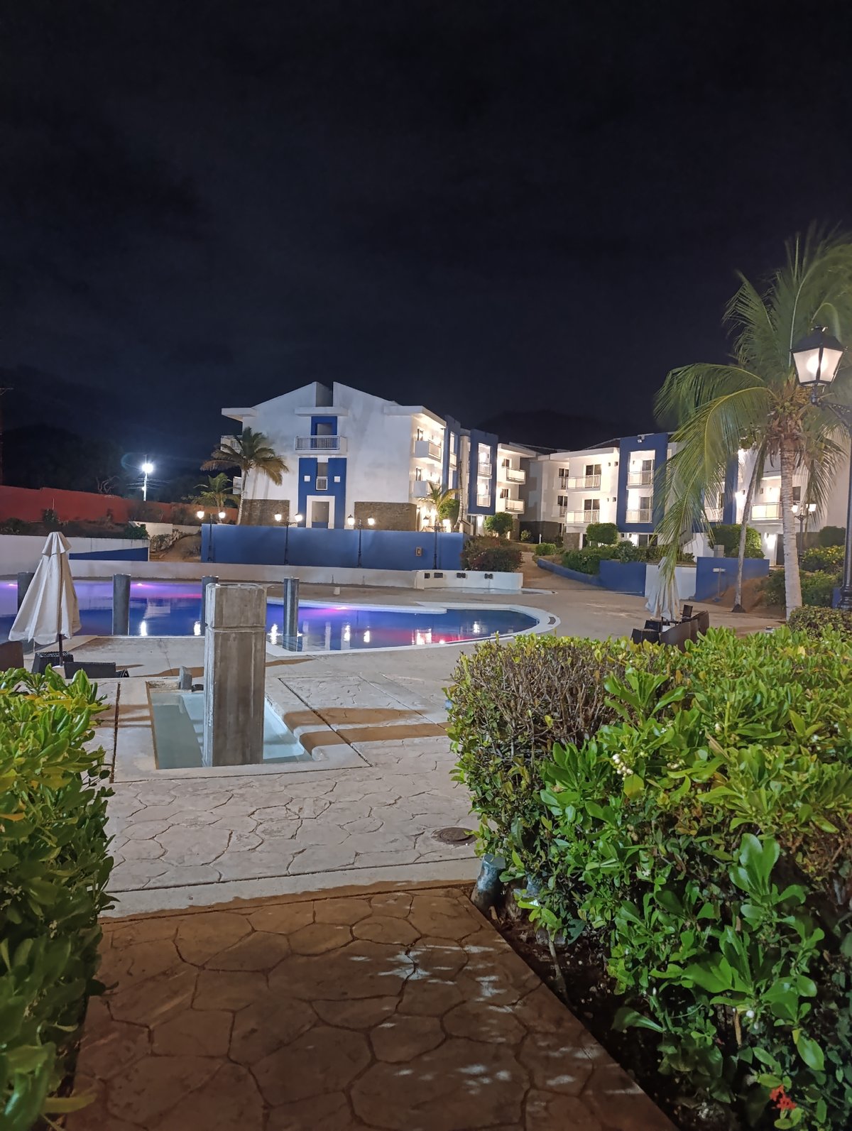 Nighttime pool scene documented in urban setting