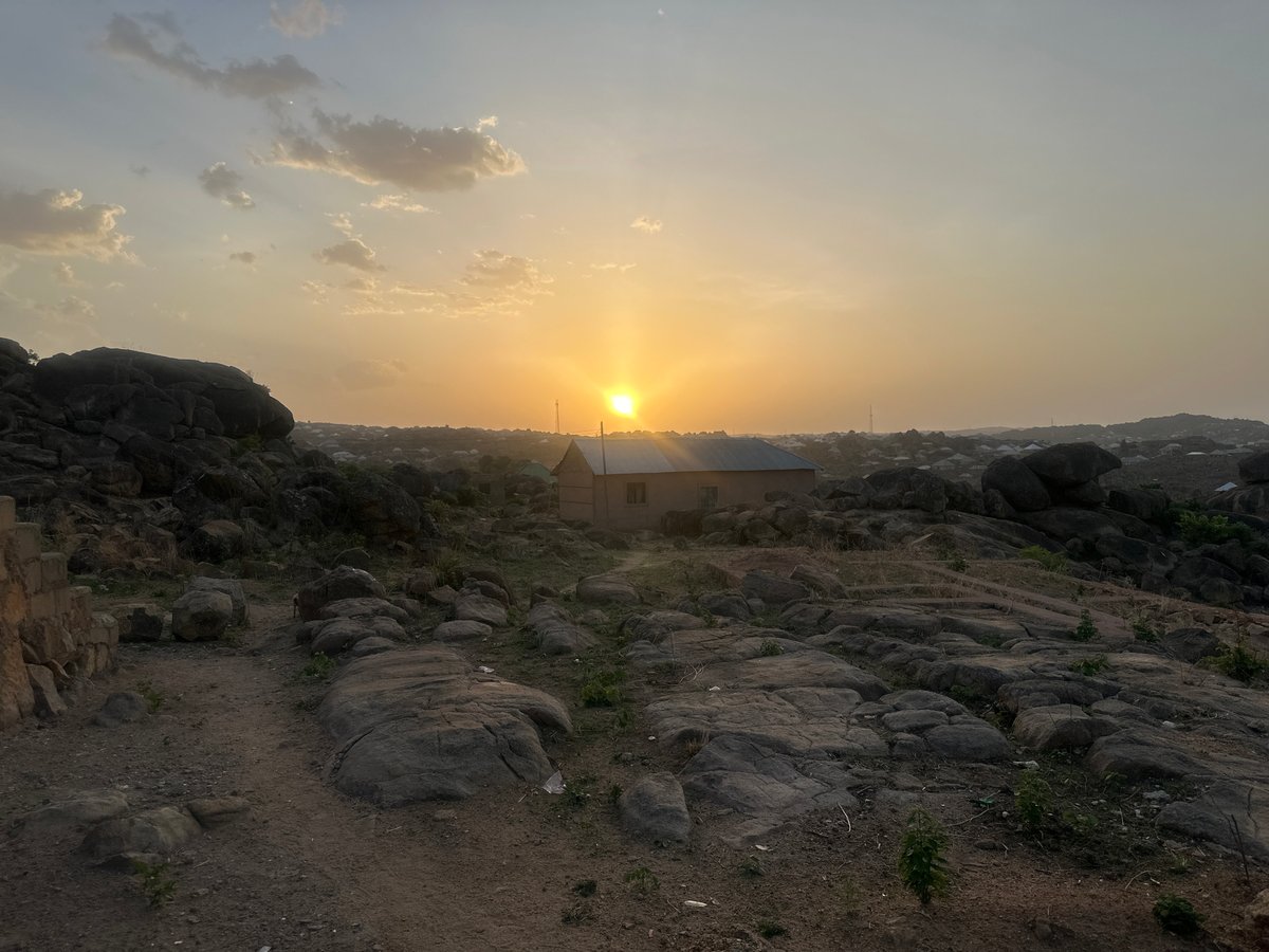 Rural livestock and rocky terrain documented in Jos, Nigeria