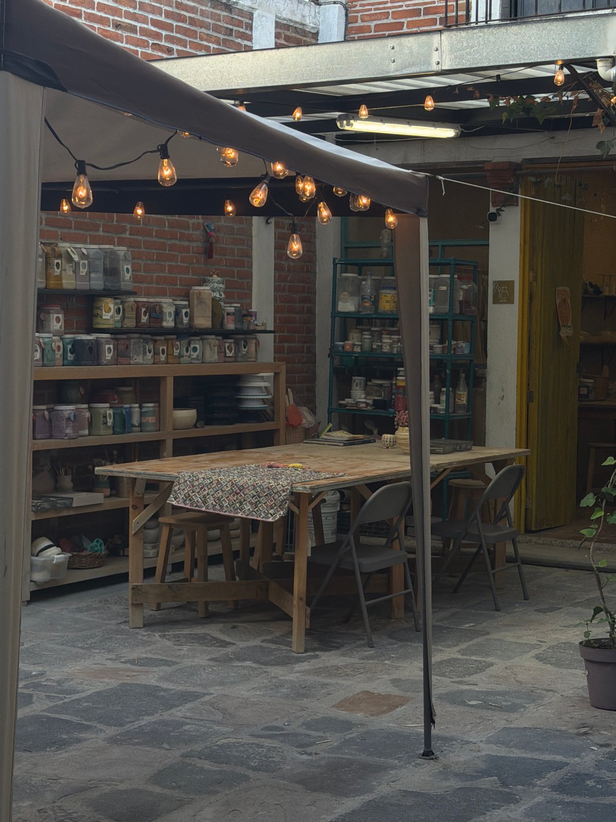 Ceramic artwork documented in outdoor workshop space