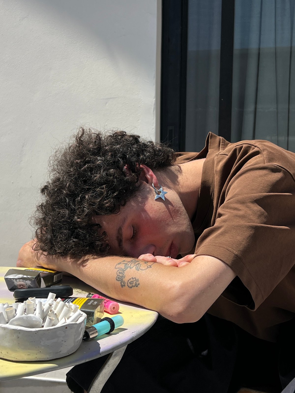 Napping at an outdoor table in Tel Aviv