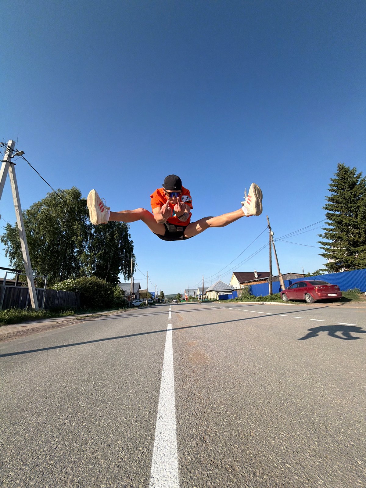 Man performs aerial split jump on Chaikovsky street