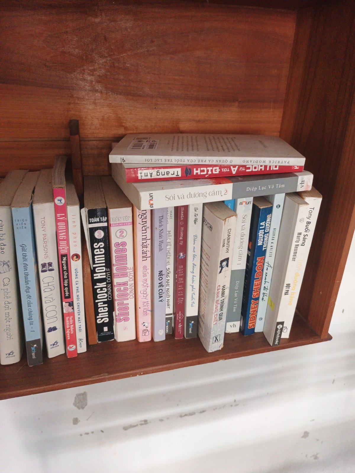 Lazy morning at a cozy Nha Trang café with books and blossom streets